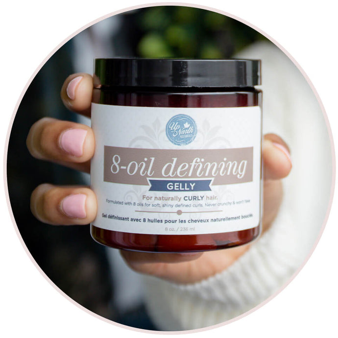 Woman holding the Up North Naturals 8-oil Defining Gelly